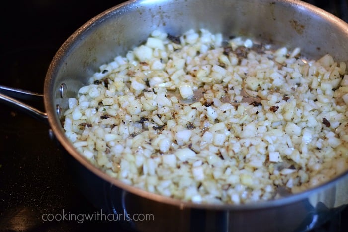 Butter and diced onions in a large skillet.