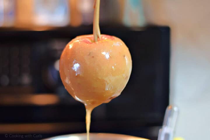 Caramel dripping off an apple.