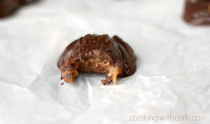 A chocolate frog with its head bitten off showing the caramel inside.