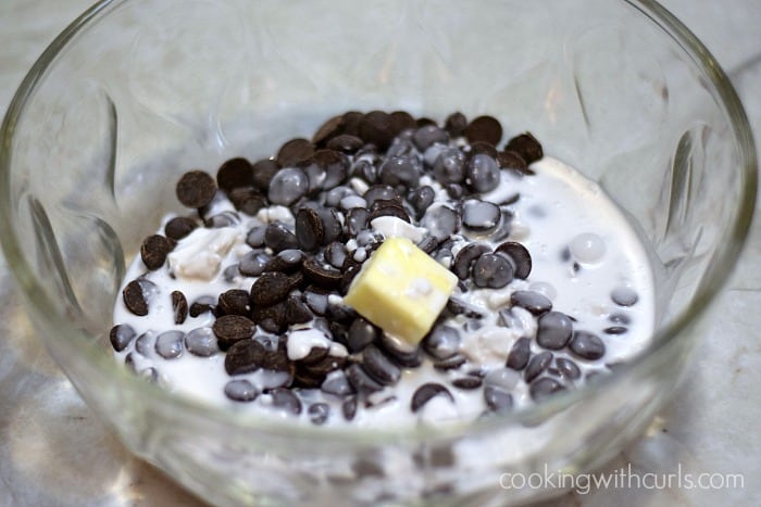 Chocolate chips, cream, and butter in a large bowl.