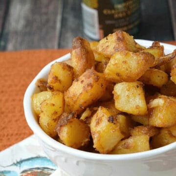 Crispy roast potatoes in a serving bowl.