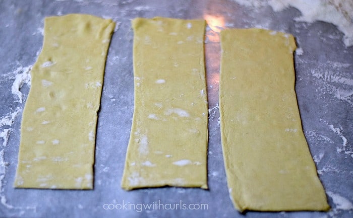 One sheet of puff pastry cut into three strips.