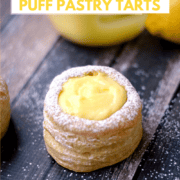 Lemon Curd filled puff pastry tarts sprinkled with powdered sugar and title graphic across the top.