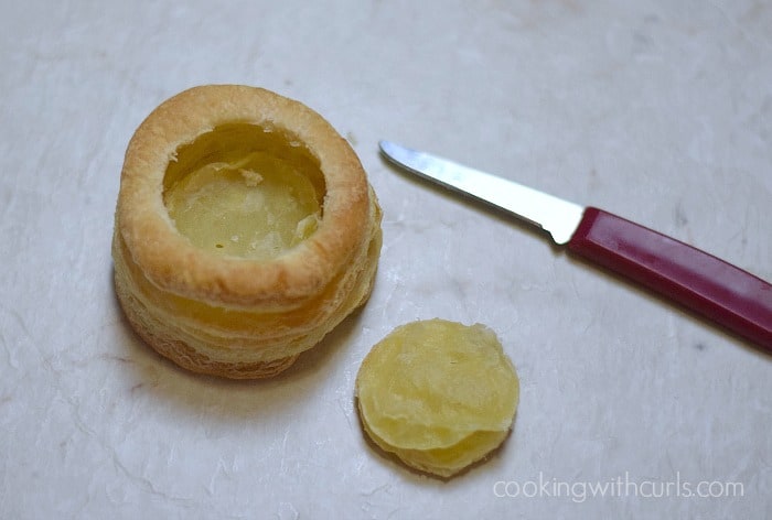 The center hole cut out of the puff pastry shell with a small knife.
