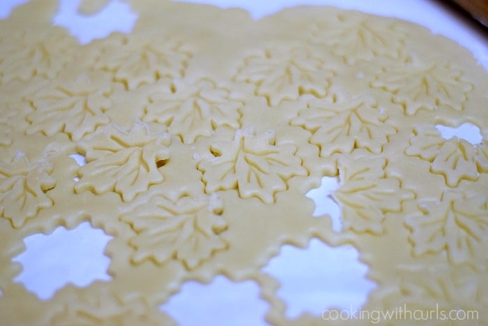 Pie crust cut into shapes with a cookie press.