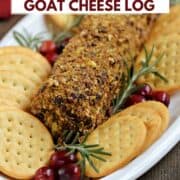 Cranberry pecan goat cheese log on a plate with crackers and title graphic across the top.