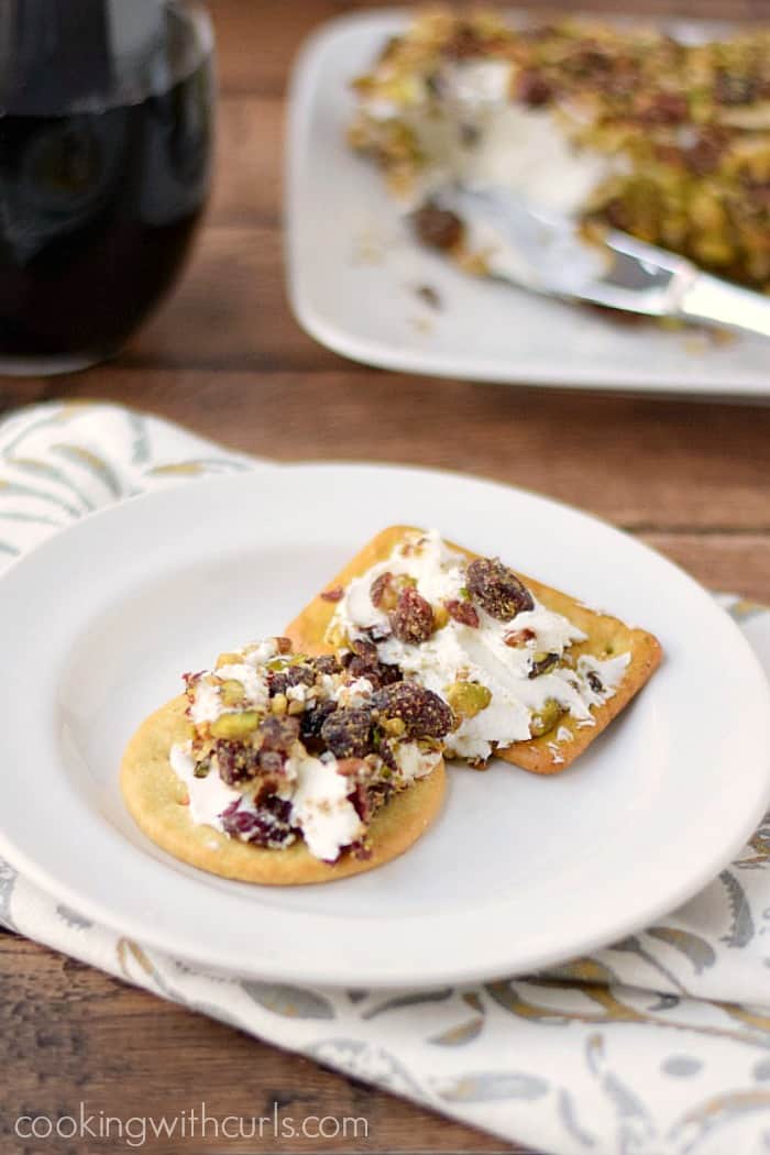 Serve this delicious Cranberry Pecan Goat Cheese Log at your next party and your guests will love you! cookingwithcurls.com
