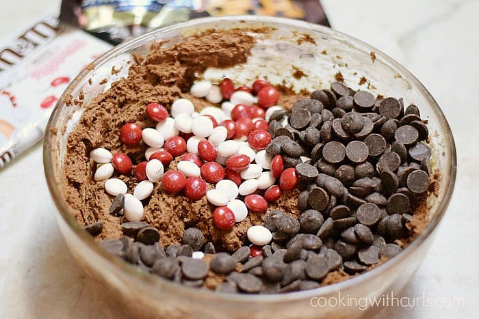 Stir the M&Ms and chocolate chips into the cookie dough cookingwithcurls.com