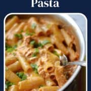 Chicken enchilada pasta in a large skillet with title graphic across the top.