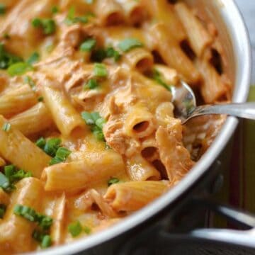 Chicken enchilada pasta in a large skillet