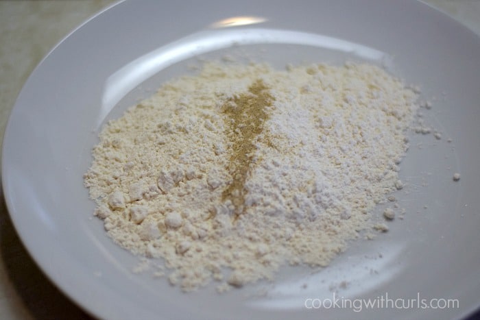 Flour, salt and pepper on a plate.