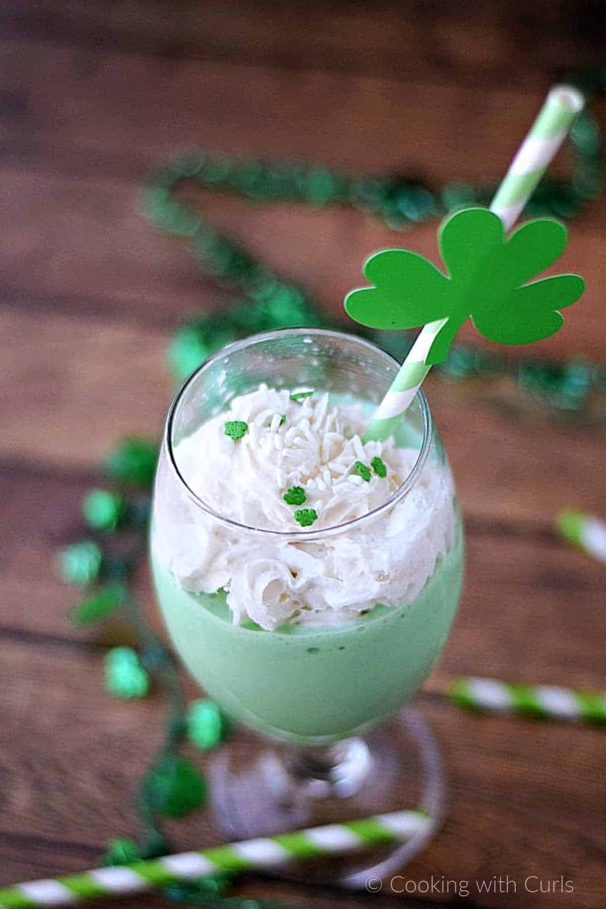 Boozy-Shamrock-Shake-topped-with-whipped-cream-and-green-sprinkles. 