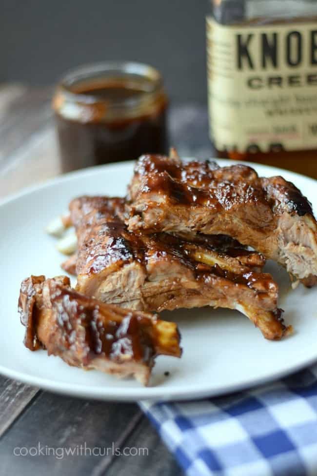 Sliced Bourbon-and-Brown-Sugar-Barbecue-Ribs on a white plate.