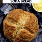 Looking down on a loaf of Traditional Irish Soda Bread with a bowl of butter on the side and title graphic across the top.