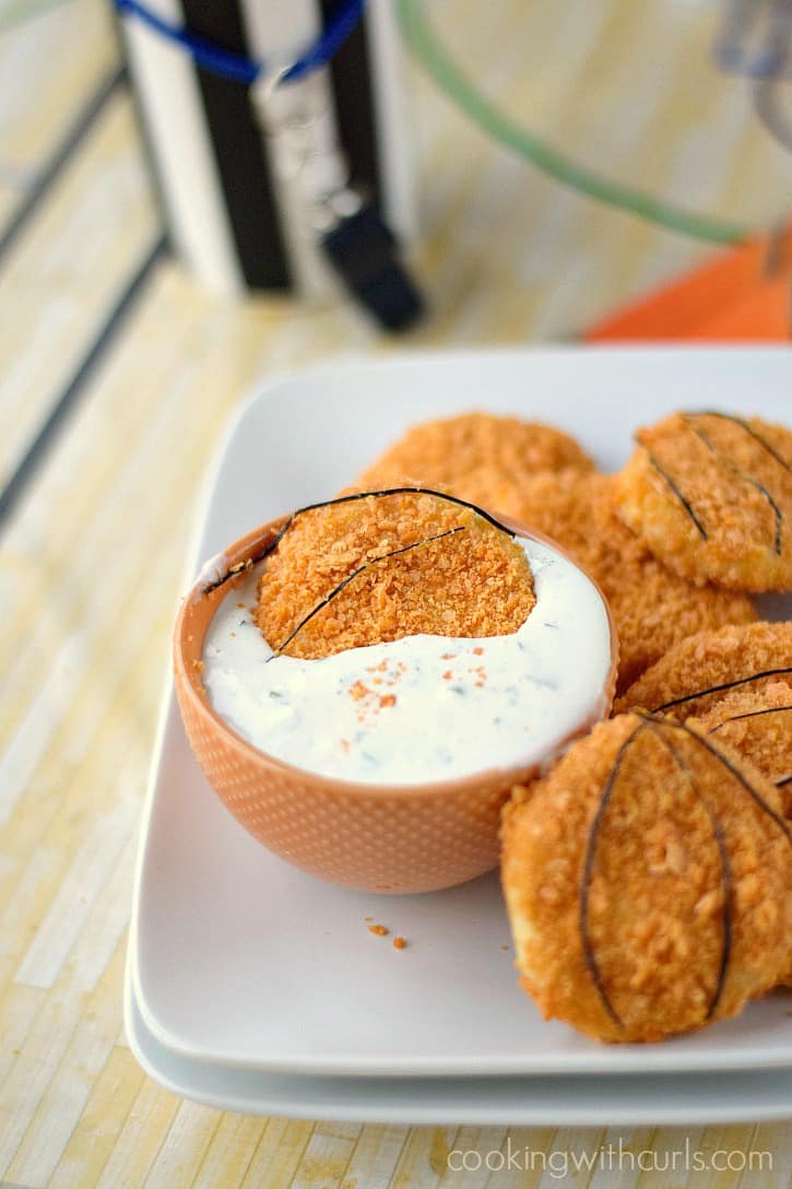 cheexe-it baked chicken tender dunked in ranch dressing
