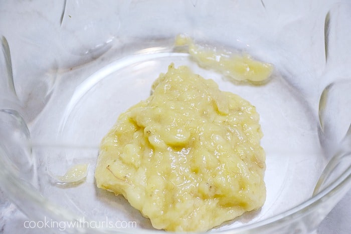 Mashed bananas in a large bowl.