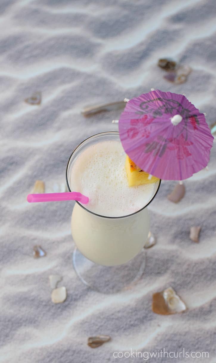 Classic Piña Colada - a sweet cocktail made with rum, coconut cream, and pineapple juice cookingwithcurls.com