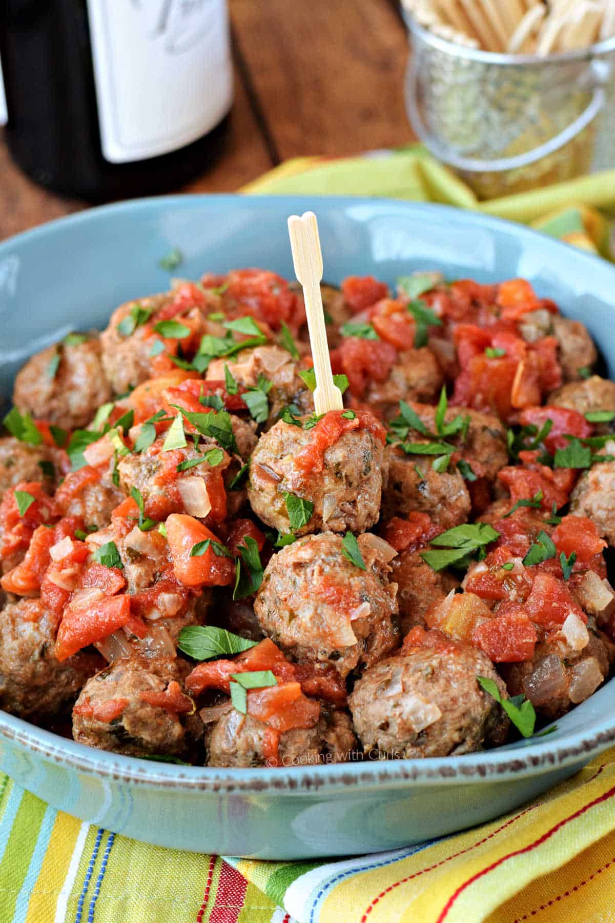 Meatballs in a tomato sauce in a serving bowl.