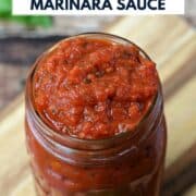 Classic Marinara Sauce in a glass jar sitting on a wood board with title graphic across the top.