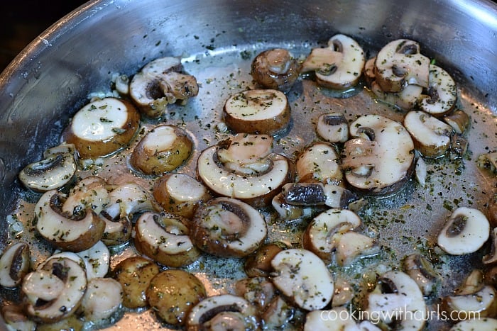 Sliced mushrooms added to the garlic butter.