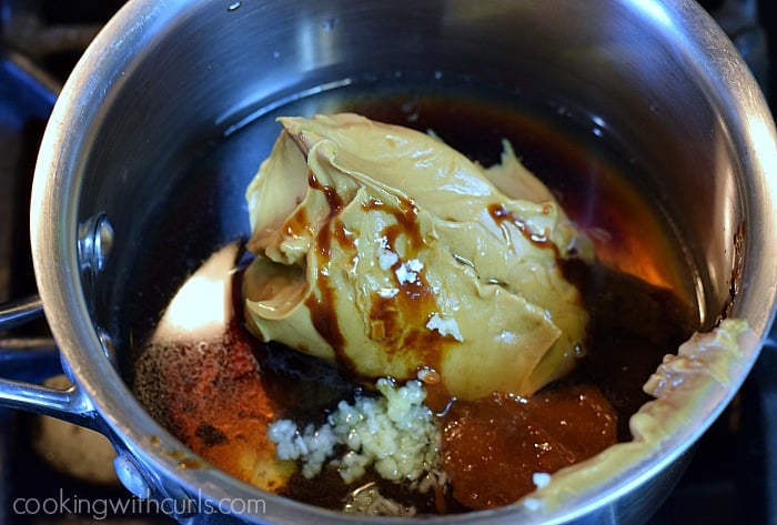 Peanut butter, garlic, and remaining sauce ingredients in a saucepan.