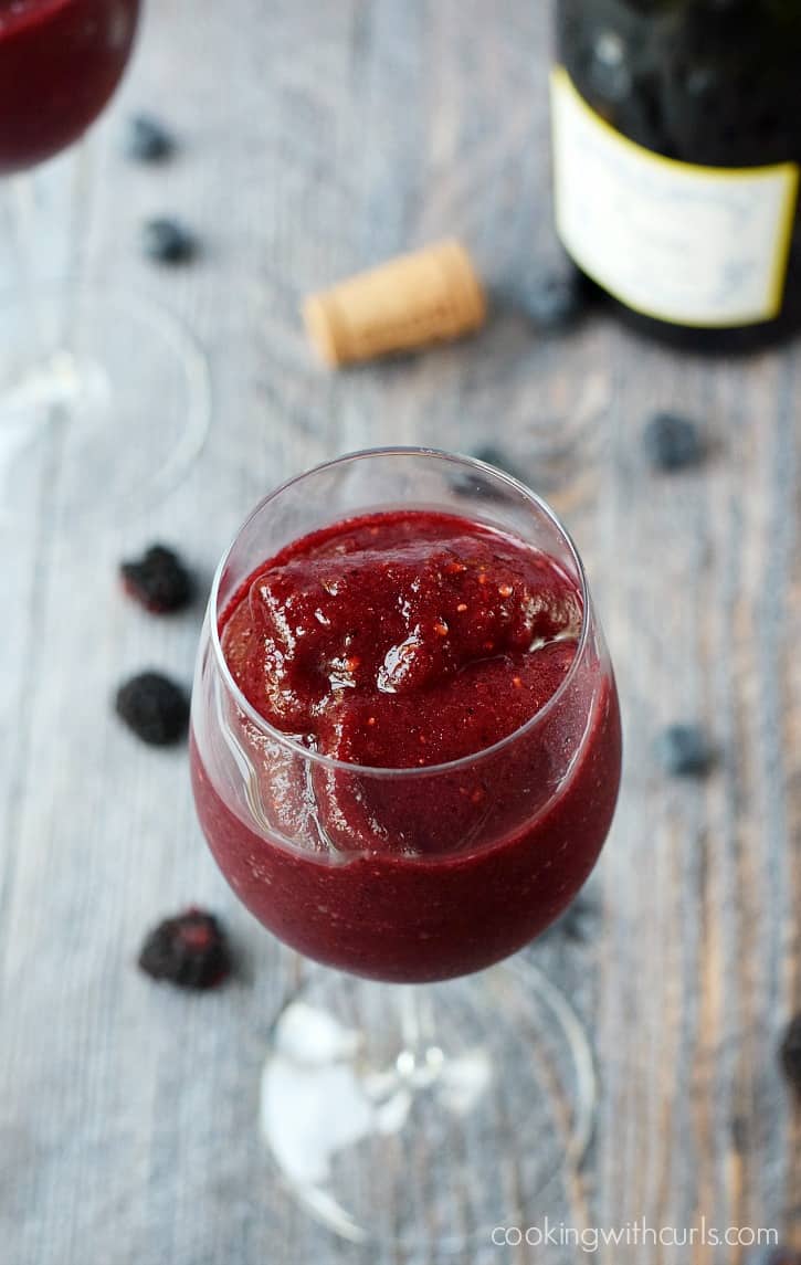 Blended berries and wine in a wine glass.