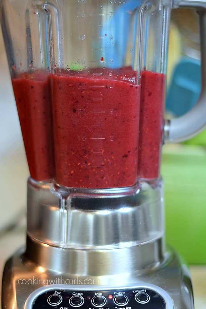 Blended wine and berries in a blender.