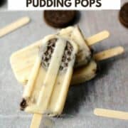 Three frozen Cookies and Cream Pudding Pops laying against each other on a tile background and title graphic across the top.