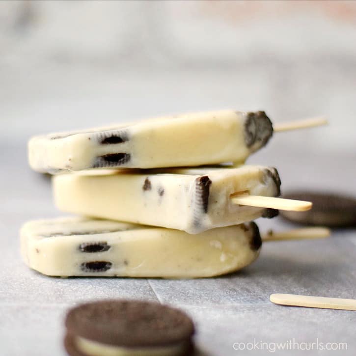 Three Cookies and Cream Pudding Pops stacked on top of each other.