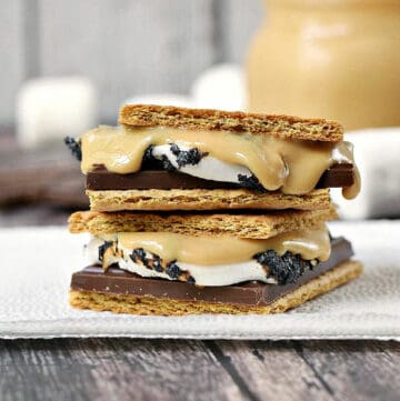 Toasted-marshmallows-chocolate-bar-and-peanut-butter-between-graham-crackers-on-a-napkin.