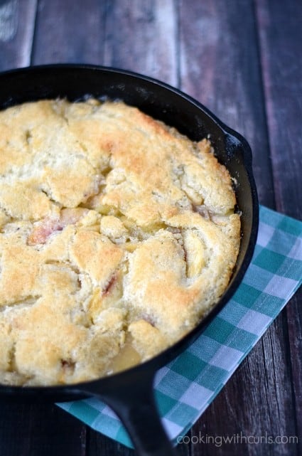 Old-fashioned Peach Cobbler baked in a skillet cookingwithcurls.com