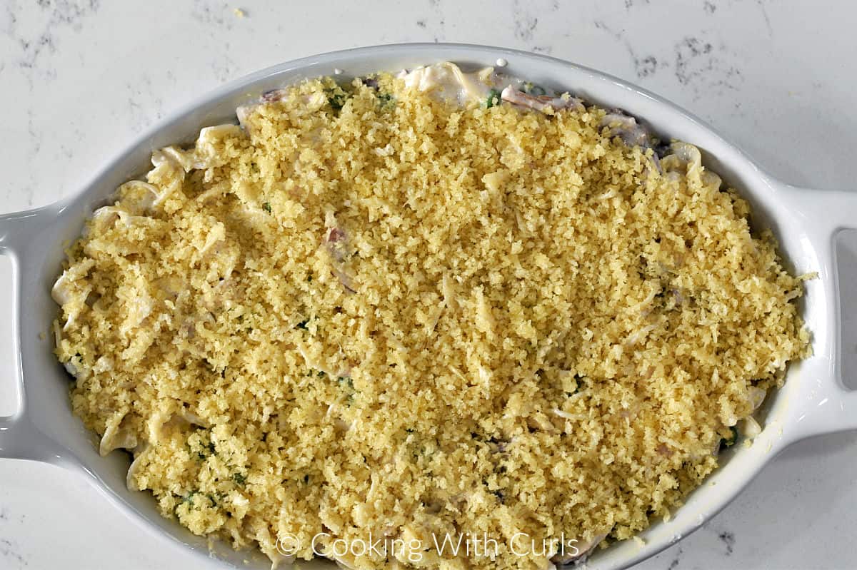 Panko topped tuna noodle casserole in a baking dish. 