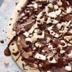 Gooey, chocolaty and delicious Chocolate Hazelnut Pizza is a fun and unexpected dessert that the whole family will love! cookingwithcurls.com
