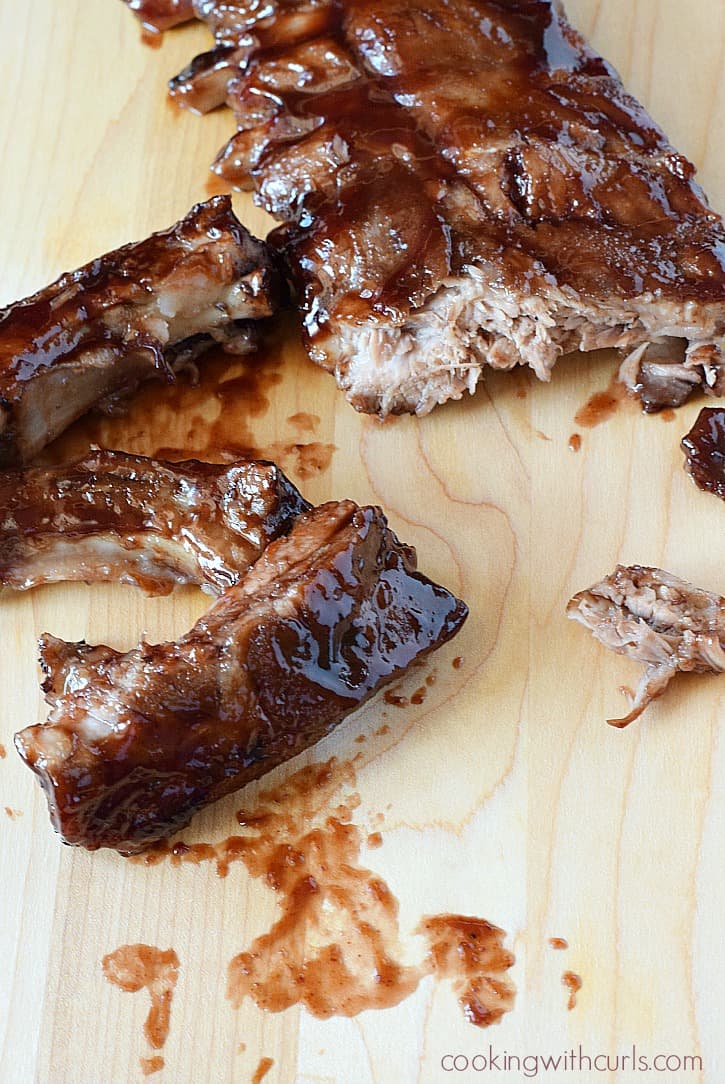 Delicious ribs covered in a tangy and sweet Cabernet Barbecue Sauce | cookingwithcurls.com