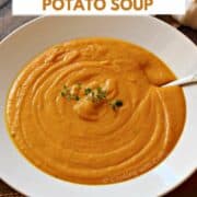 A bowl of creamy roasted sweet potato soup with sweet potatoes in the background and title graphic across the top.