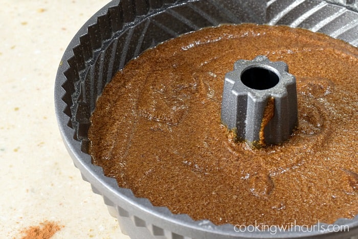 Cake batter poured into the prepared bundt pan.