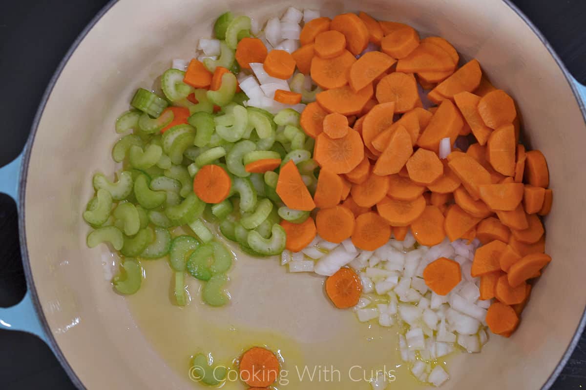 Diced onion, sliced celery and carrots with oil in a large cooking pot. 