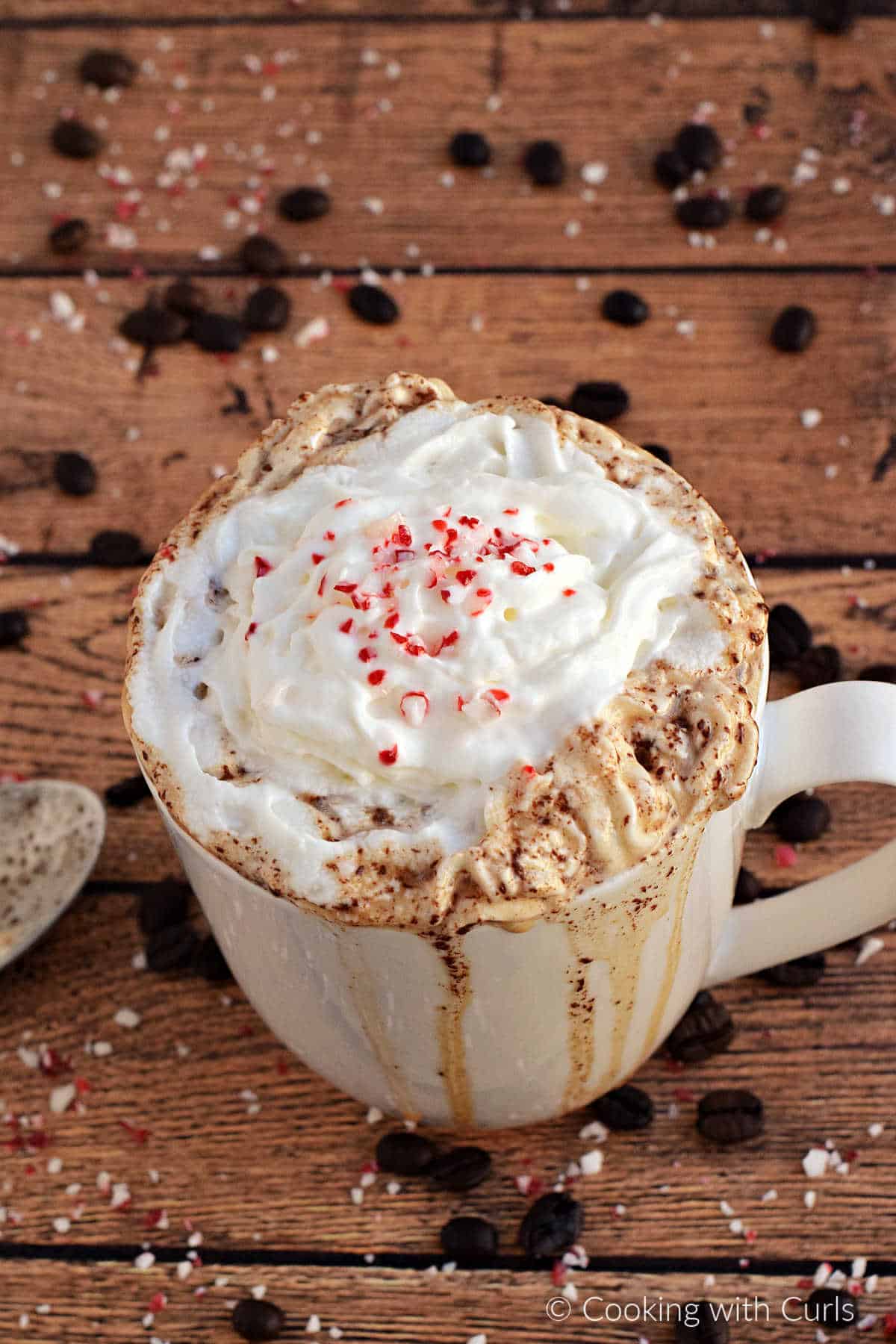 Caffe Mocha topped with whipped cream and crushed peppermint candies.