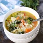 Warm up this winter with a big bowl of Chicken and Rice Soup, loaded with carrots, kale, and tomatoes | cookingwithcurls.com