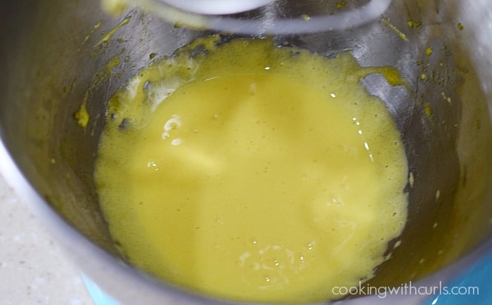 Eggs and sugar beaten together in the bowl of a stand mixer