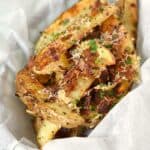 Crispy and crazy delicious Baked Parmesan-Bacon Garlic Potato Wedges for a fun and unexpected side dish! cookingwithcurls.com