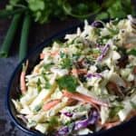 Crunchy, sweet and tangy Apple Coleslaw is the perfect topping for chicken and pork sandwiches | cookingwithcurls.com