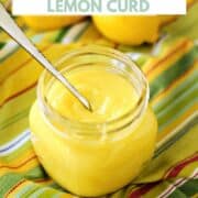 A jar of homemade lemon curd with fresh lemons in the background and title graphic across the top.