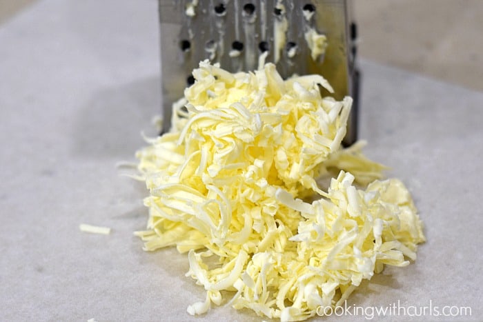 Cold butter shredded by a box grater.