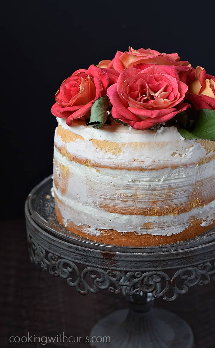 Naked 3-Layer Cake topped with roses and perfect for any special occasion | cookingwithcurls.com