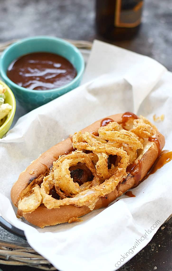 Barbecue Bacon Hot Dogs cooked on the grill and topped with crispy onion rings | cookingwithcurls.com
