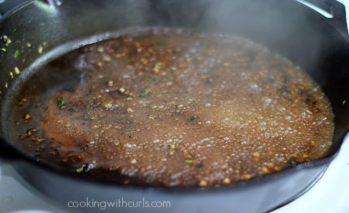 Minced garlic, oregano, and tequila simmering in the cast iron skillet.
