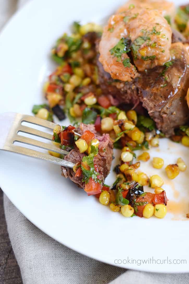 A perfectly cooked Beef Tenderloin with Tomato Butter Shrimp and Grilled Corn Relish will make date night extra special | cookingwithcurls.com