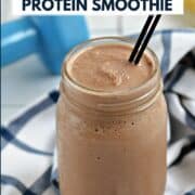 A chocolate smoothie in a mason jar with a dumbbell and banana in the background with title graphic across the top.