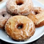 Apple Cider Doughnuts that are light and fluffy on the inside, and crispy delicious on the outside draped in glaze or cinnamon sugar | cookingwithcurls.com